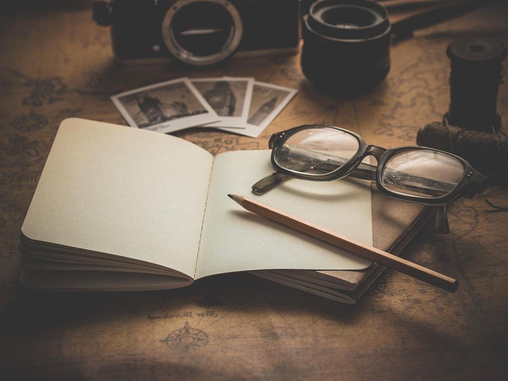 Person wearing AR glasses manipulating holographic 3D models